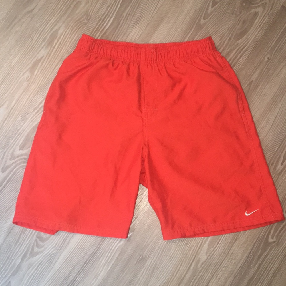 Orange Nike swim trunks